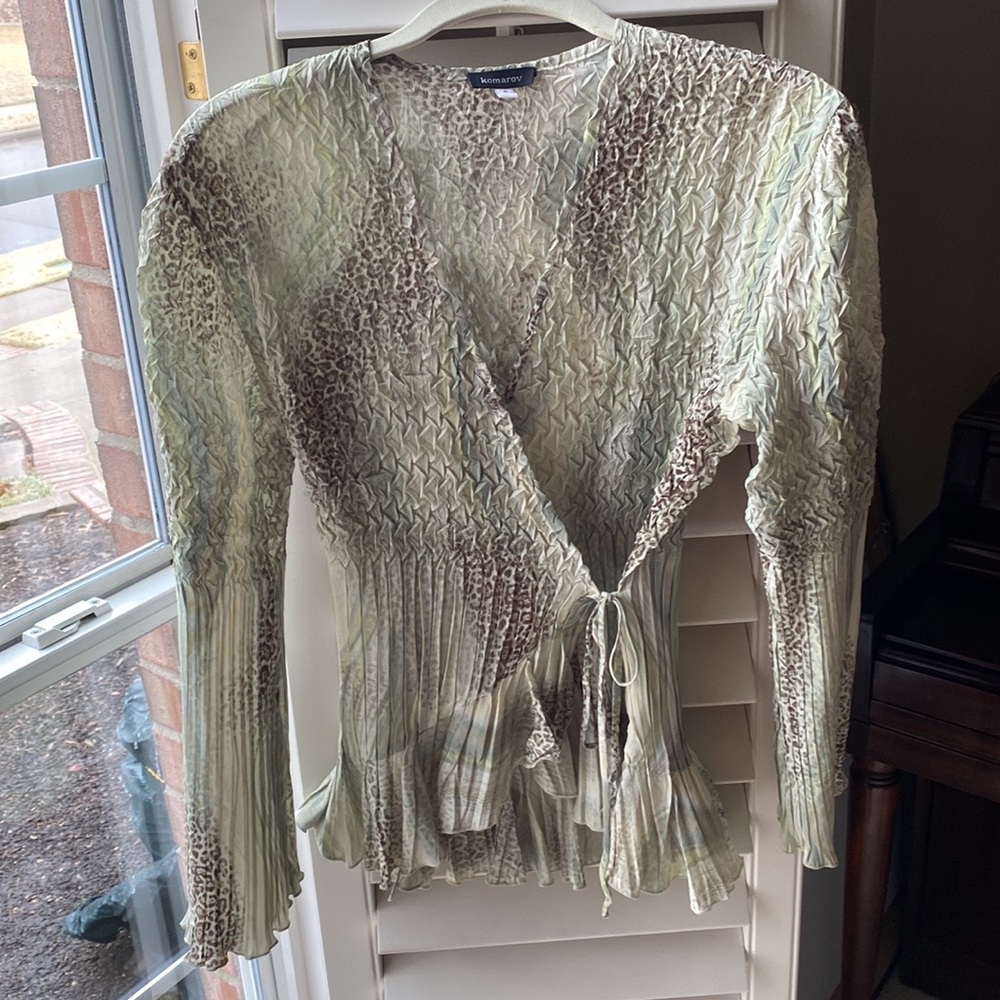 Komarov wrap front blouse that ties on the front left side. Very flattering on.